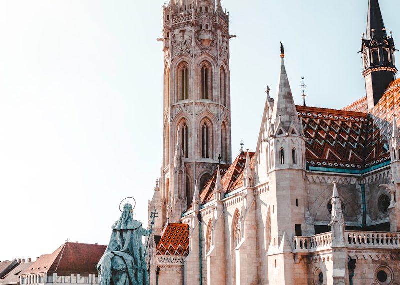 Statue in front of a cathedral in Budapest
