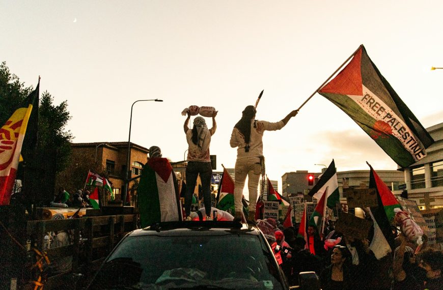 a group of people standing on top of a truck