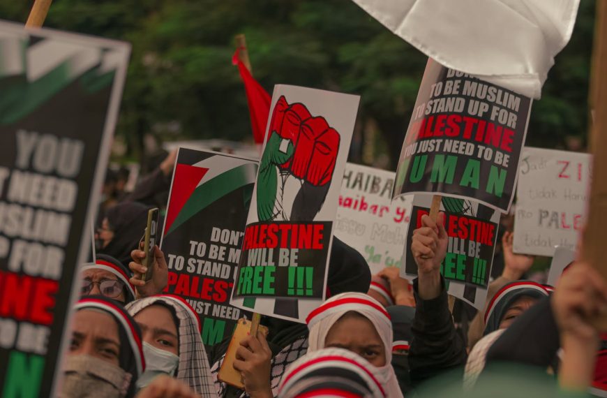 Demonstrators in Jakarta rally for Palestine with impactful signs and expressions of solidarity.