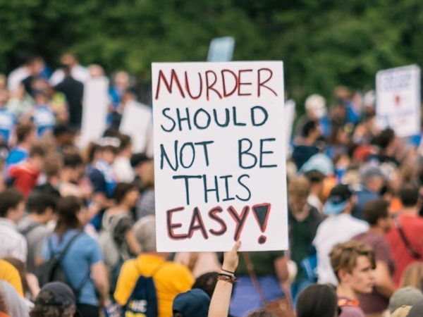 a crowd of people holding signs